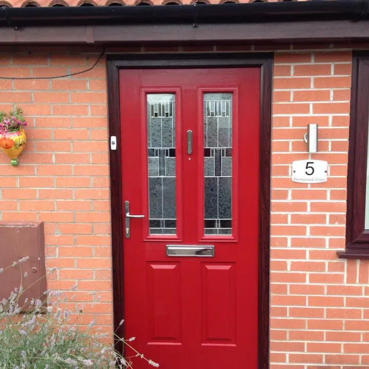 red front door with art deco style glazing