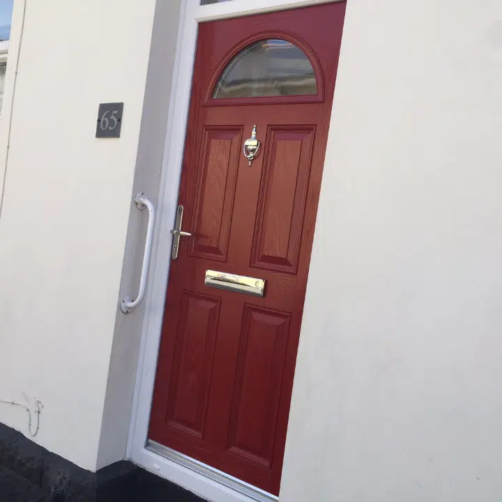 red front door with silver furniture