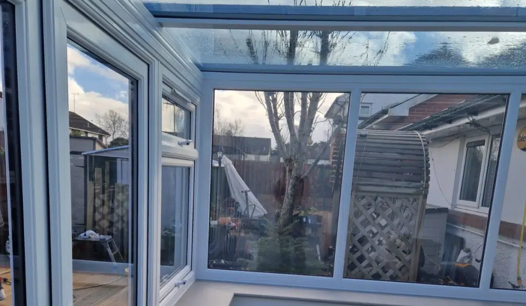 white upvc conservatory with glass roof