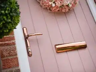 pink front door with sweet hardware