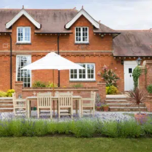 back of traditional house with georgian windows and timber back door